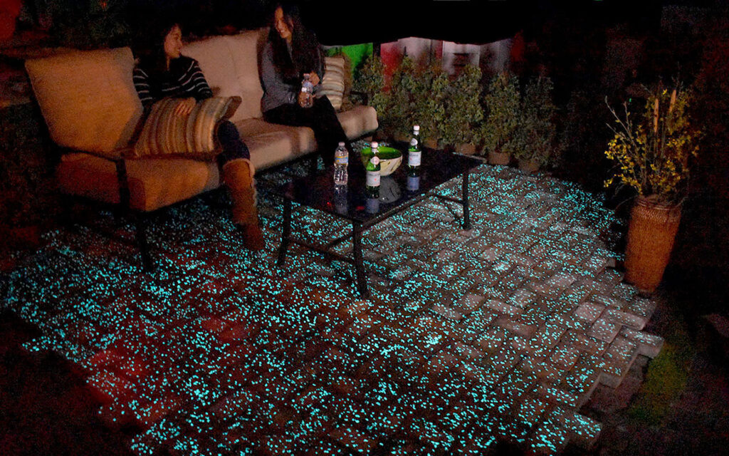 Ladies enjoying the night on a Glow Path Paver patio